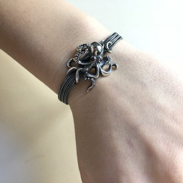 Silver 925, handmade octopus bracelet with garnet eyes.
